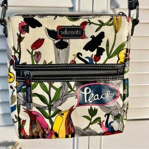 Two pieces. Crossbody Bag & Matching Wristlet with Artistic Design.
